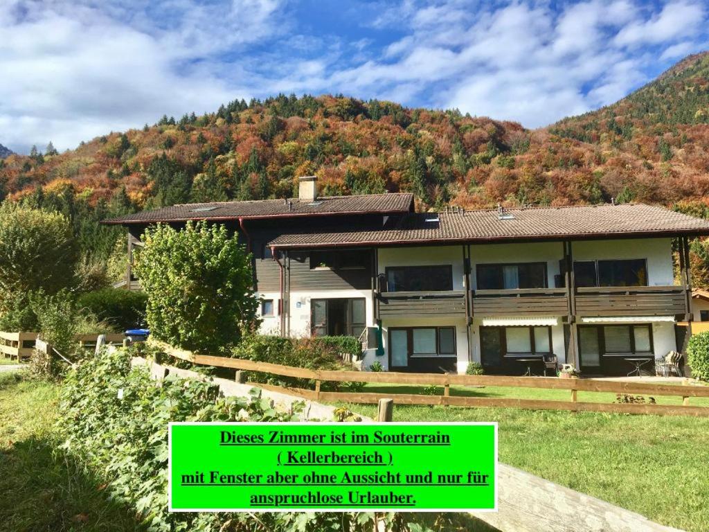 a house in front of a mountain at Apartment Geigelsteinstrasse in Schleching