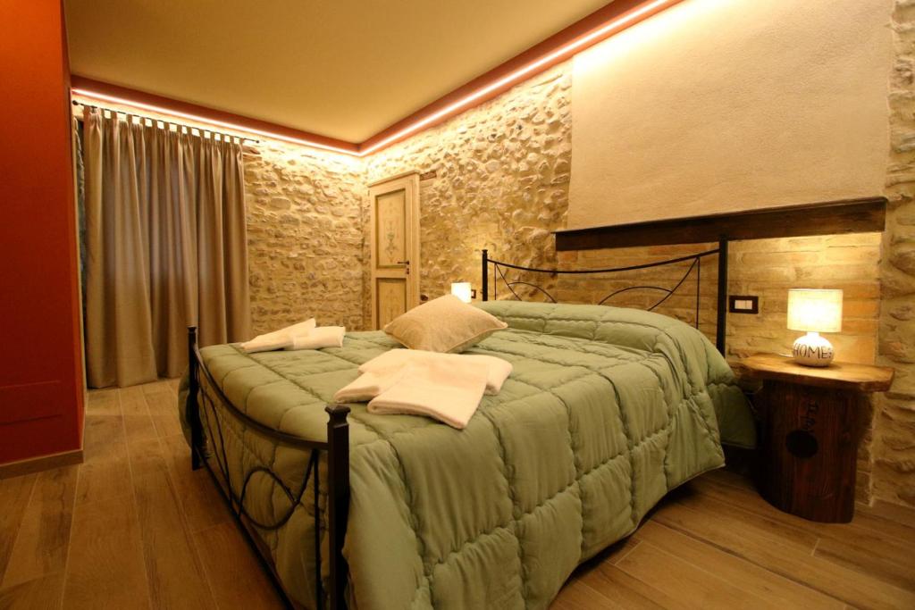 Giường trong phòng chung tại Le Dimore dei Ritaldi
