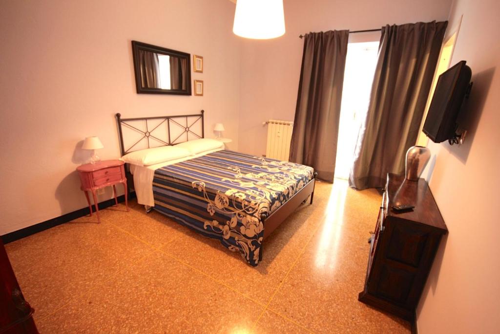 Postel nebo postele na pokoji v ubytování B&B I Portici Di Sottoripa