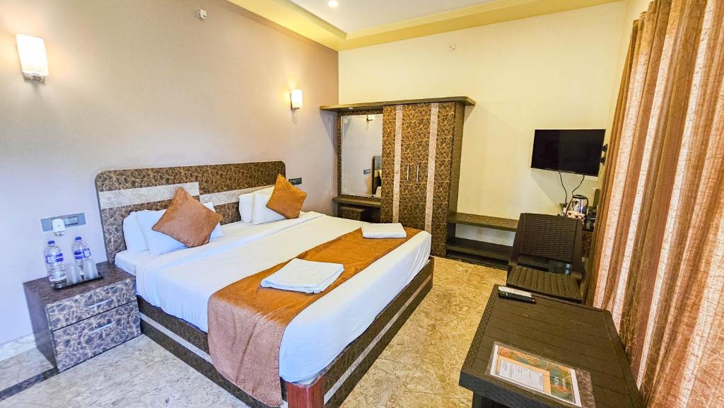 TV a/nebo společenská místnost v ubytování IHotels Yercaud