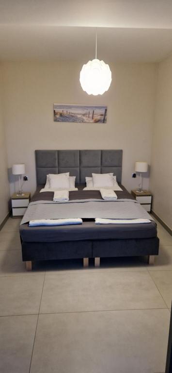 Posteľ alebo postele v izbe v ubytovaní Willa Dobryłko II -Apartamenty
