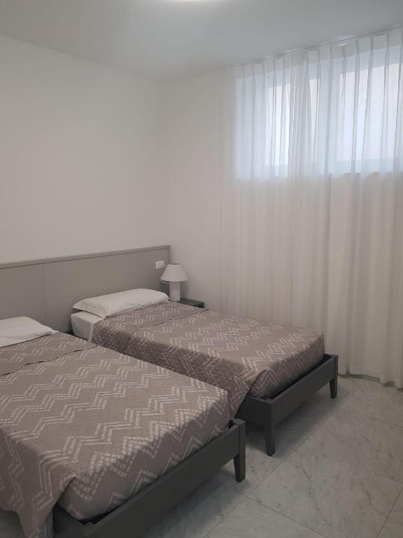 Postel nebo postele na pokoji v ubytování HOTEL LORENA
