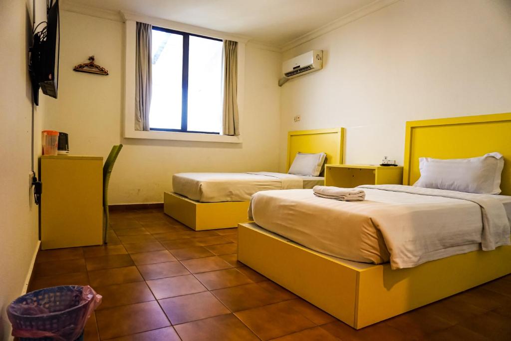 Postel nebo postele na pokoji v ubytování Y Hotel