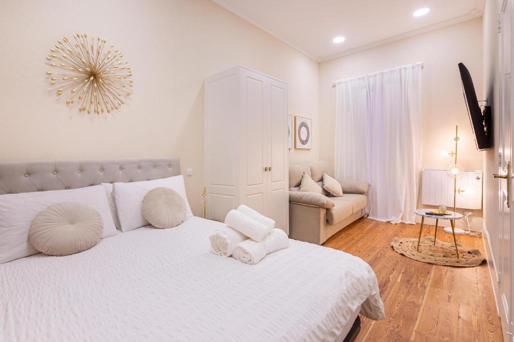 Céntrico Apartamento Vigo- Oporto Luxury tesisinde bir odada yatak veya yataklar