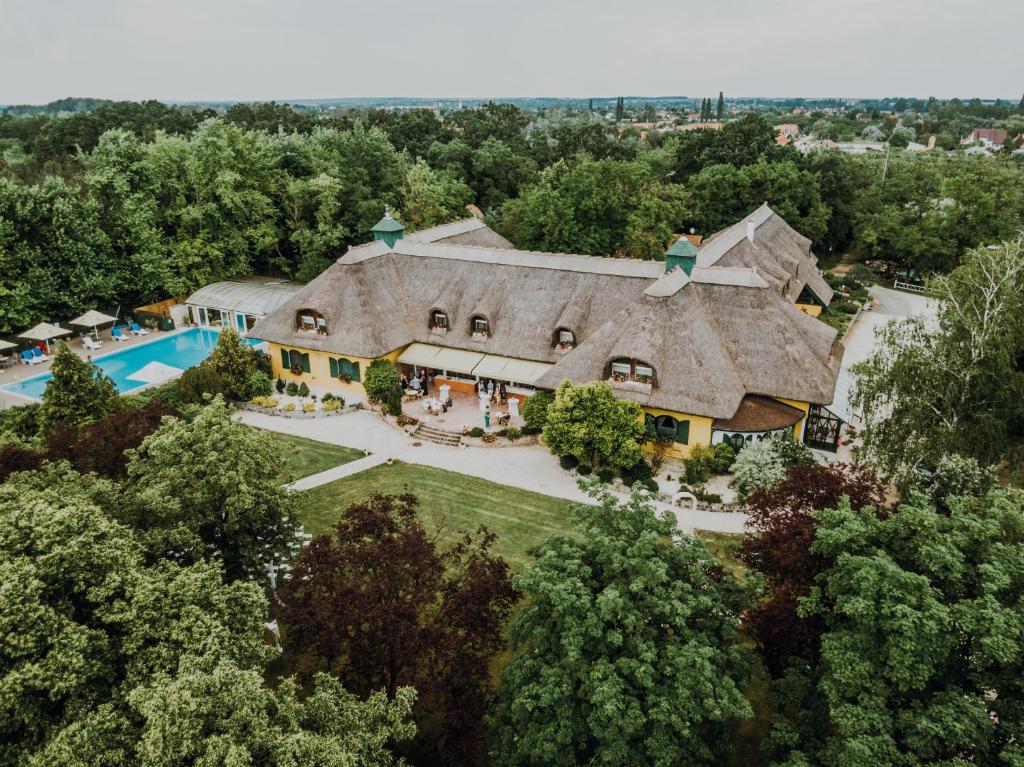 an aerial view of a large house with a pool at Nyerges Hotel Termál Superior in Monor