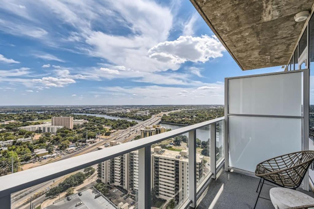 a balcony with a view of a city at Luxury 1BR with Views, Rooftop Pool and Walk To Rainey St. in Austin