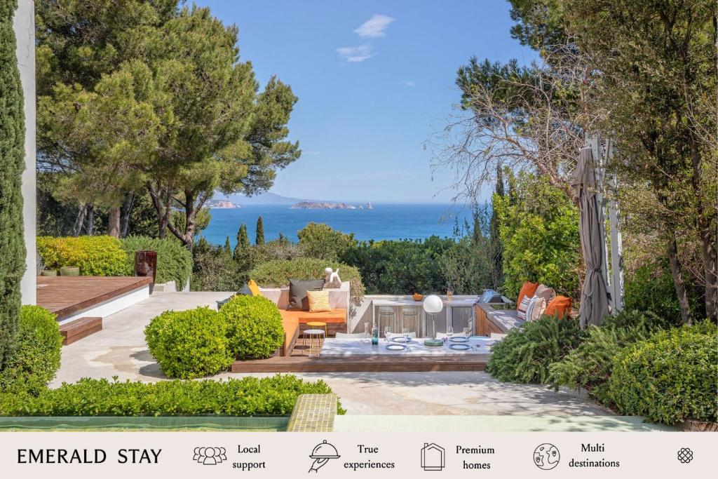 a garden with a view of the ocean at Villa Verde Costa Brava - BY EMERALD STAY in Begur