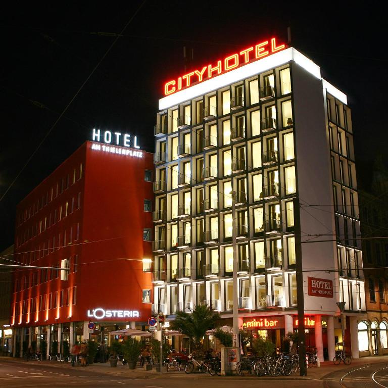a building with a hotel sign on top of it at Cityhotel am Thielenplatz in Hannover