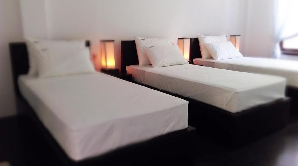 Postel nebo postele na pokoji v ubytování Lakmini Lodge Sigiriya
