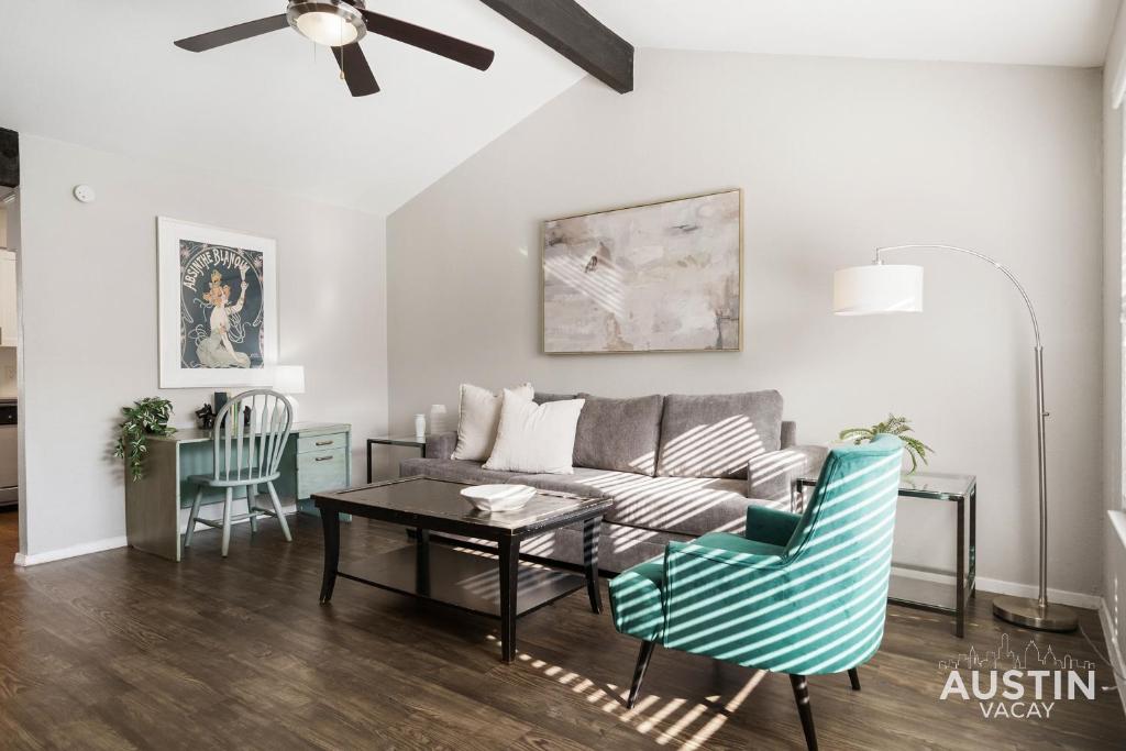 a living room with a couch and a table at Walk to Barton Springs Spacious Apt Backyard in Austin