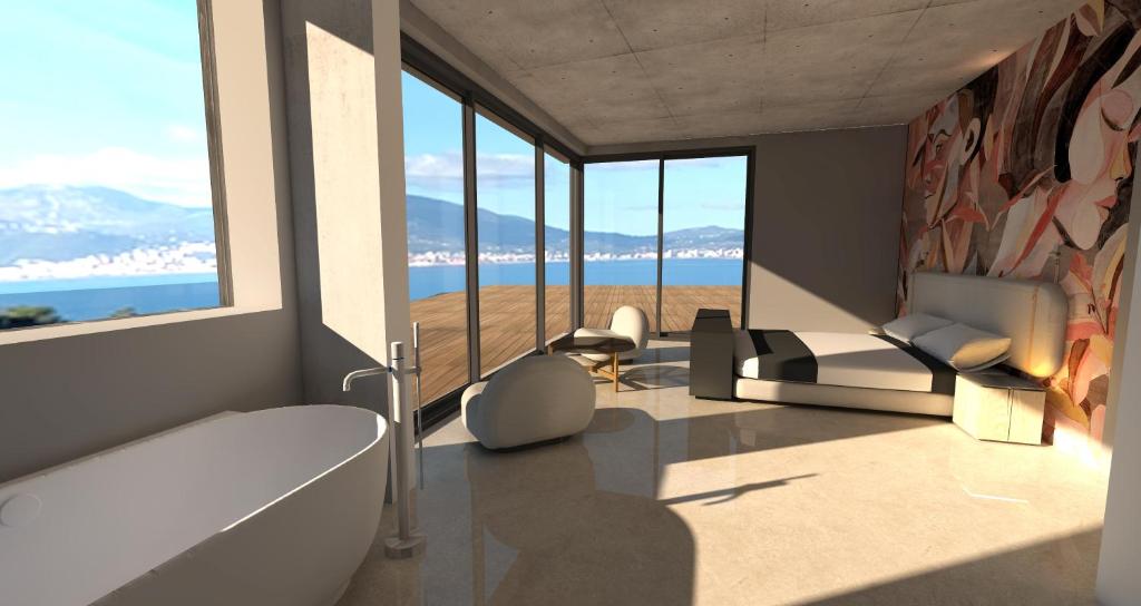 a living room with views of the ocean and mountains at Villa Urbana in Porticcio