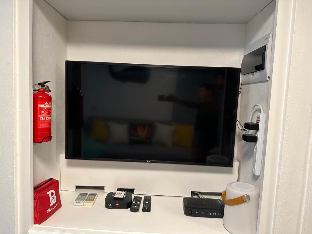 TV a/nebo společenská místnost v ubytování EL TOUCAN, Apartament in bayahibe