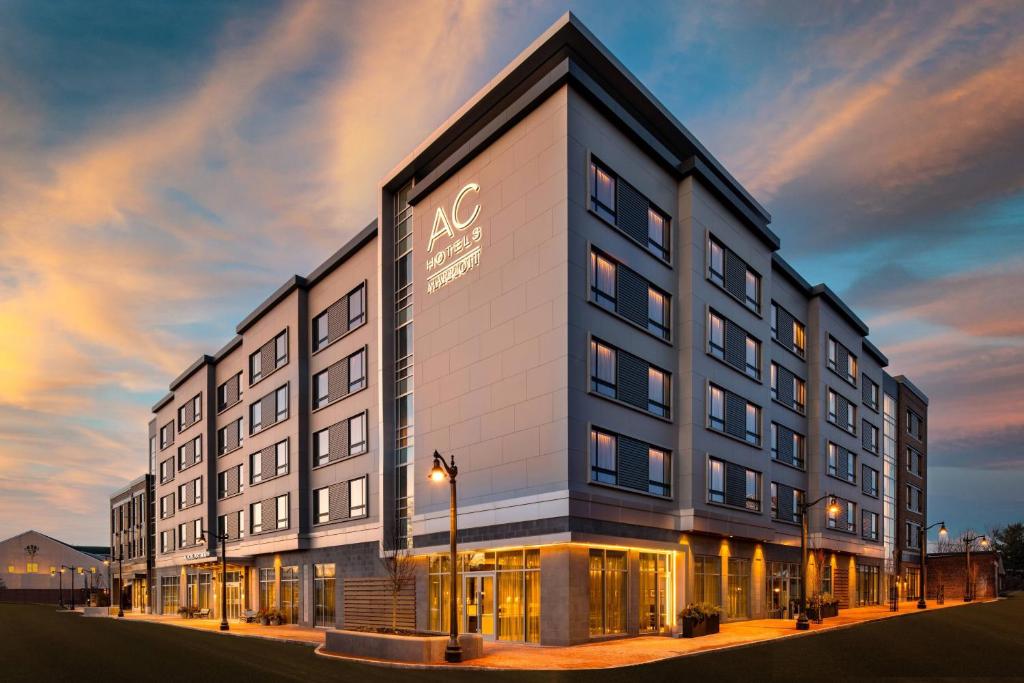 a building with a sign on the side of it at AC Hotel by Marriott Portsmouth Downtown/Waterfront in Portsmouth