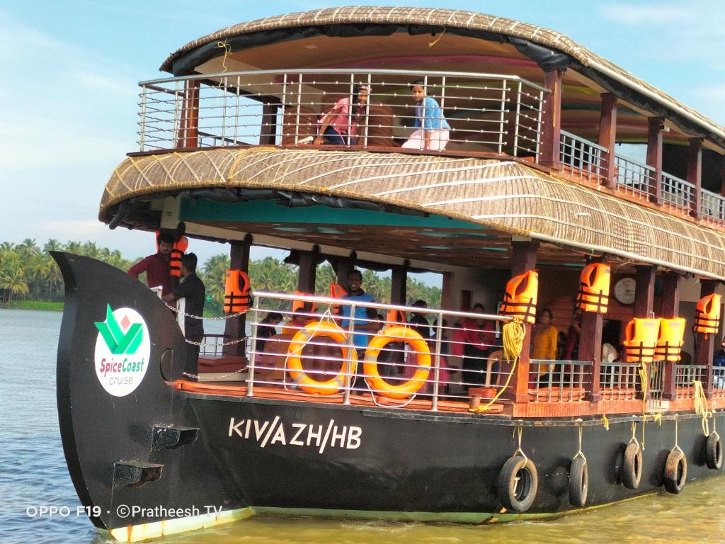 a double decker ferry boat on the water at Spice coast cruise in Kokkānisseri