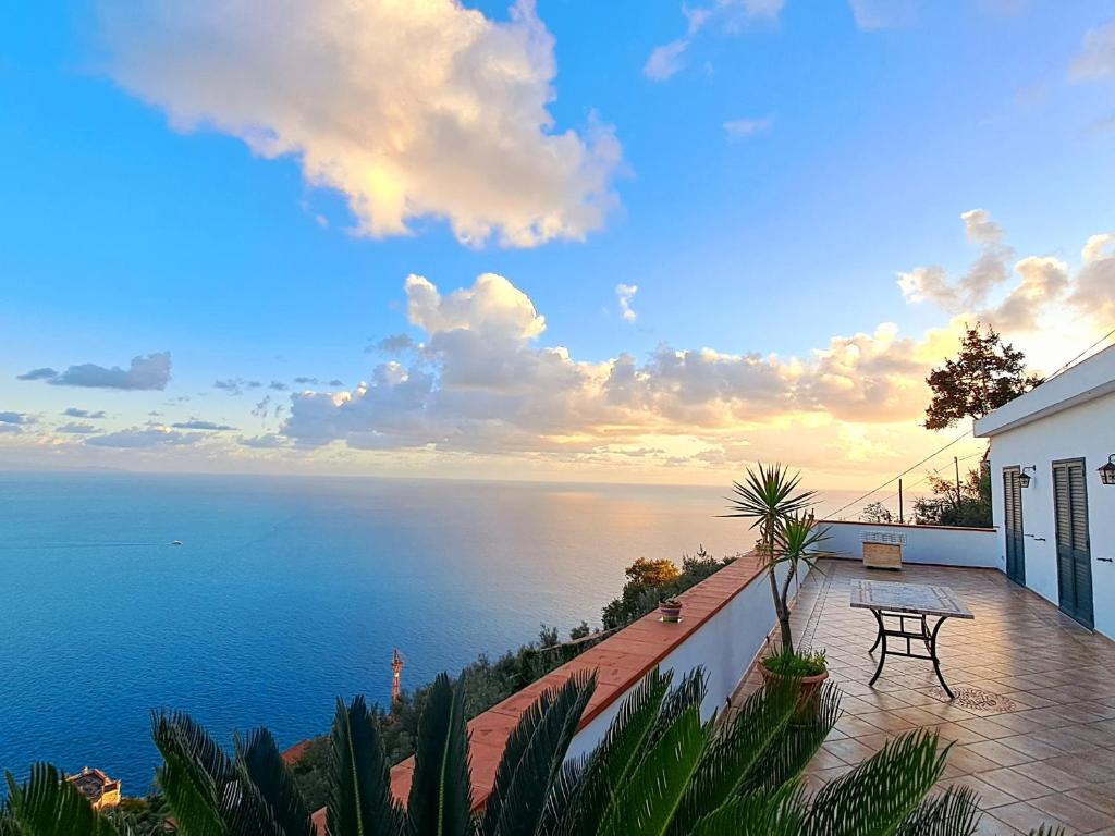 a view of the ocean from the balcony of a house at "CASALENA" Villa a Furore Amalfi coast con grande terrazzo e vista sul MARE in Furore