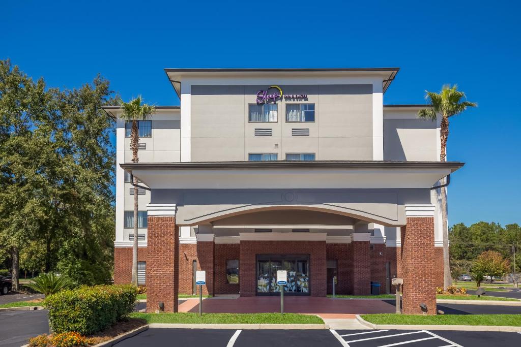 a rendering of a building with a parking lot at Sleep Inn & Suites North Mobile Saraland in Saraland