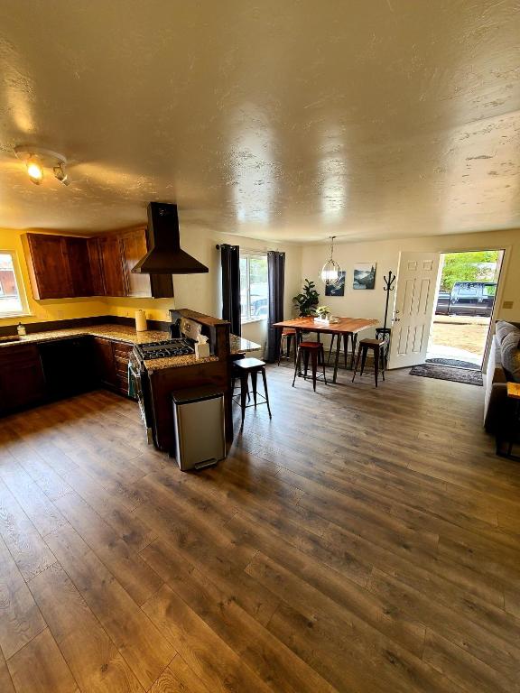 a living room with a table and a dining room at The Gold Mine Cottage in Idaho City