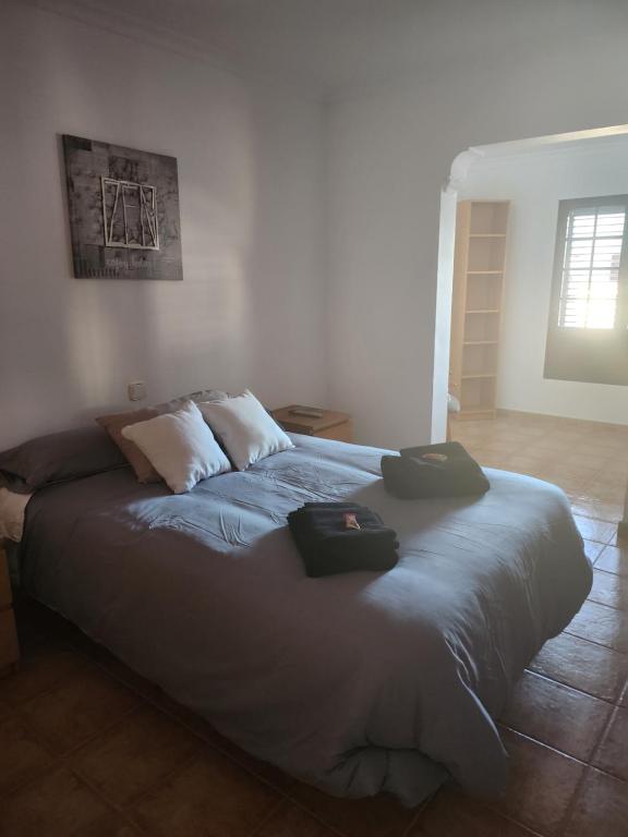 Posteľ alebo postele v izbe v ubytovaní Casa la Bufona