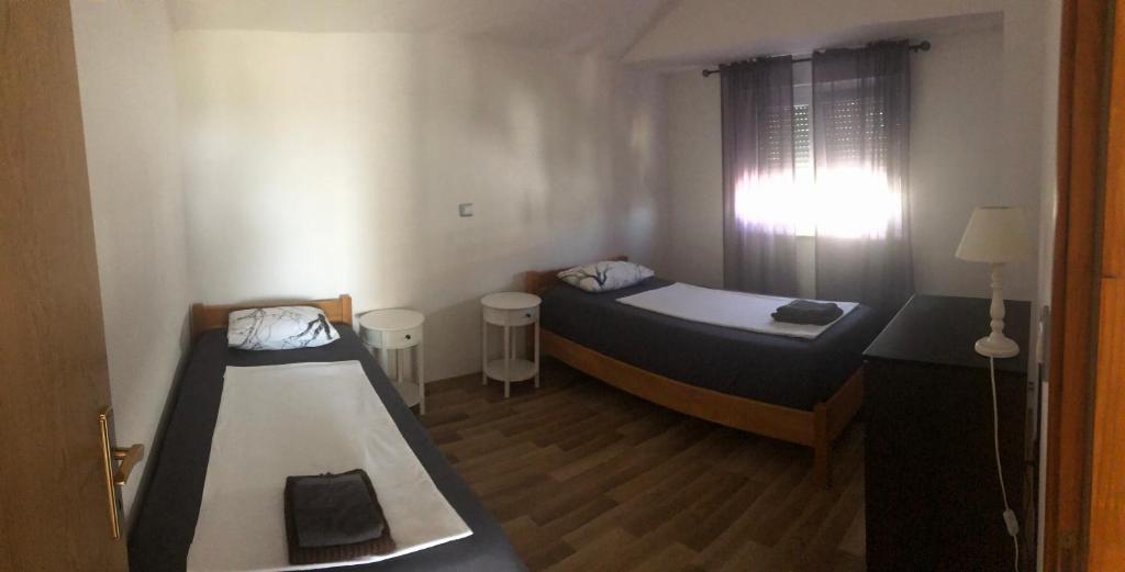 Posteľ alebo postele v izbe v ubytovaní Apartments Nicole Wera
