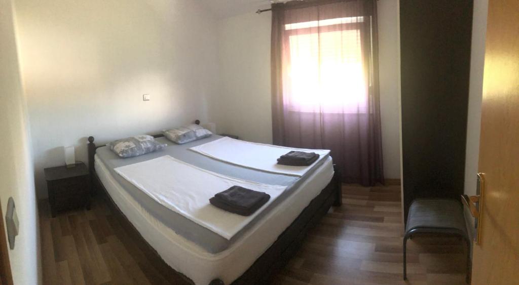 Posteľ alebo postele v izbe v ubytovaní Apartments Nicole Wera