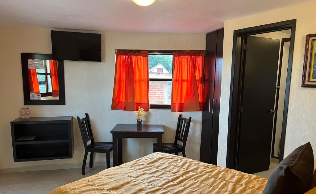 Postel nebo postele na pokoji v ubytování Hotel Posada Real