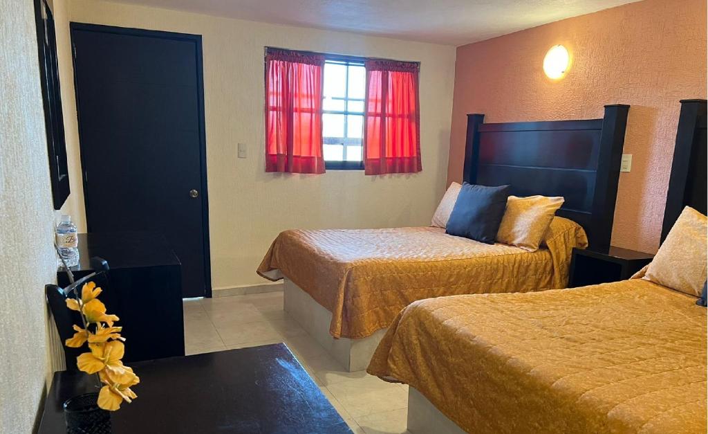 Postel nebo postele na pokoji v ubytování Hotel Posada Real
