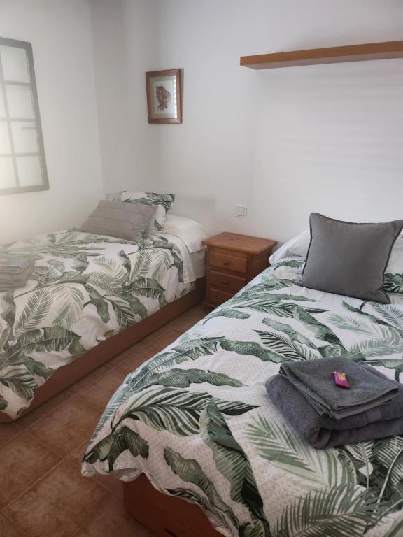 Posteľ alebo postele v izbe v ubytovaní Casa la Bufona