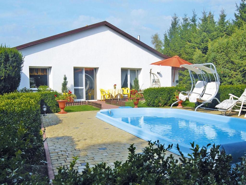 a house with a swimming pool in the yard at Terraced house, Sieciemin in Sieciemin