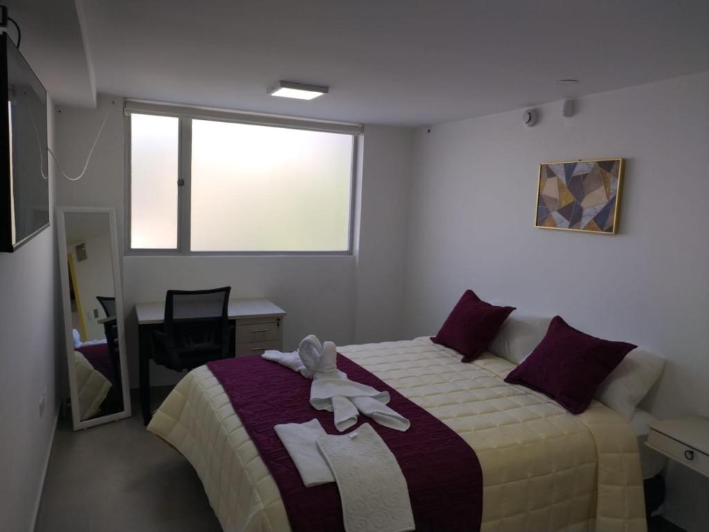 Postel nebo postele na pokoji v ubytování HOSTAL VERONA