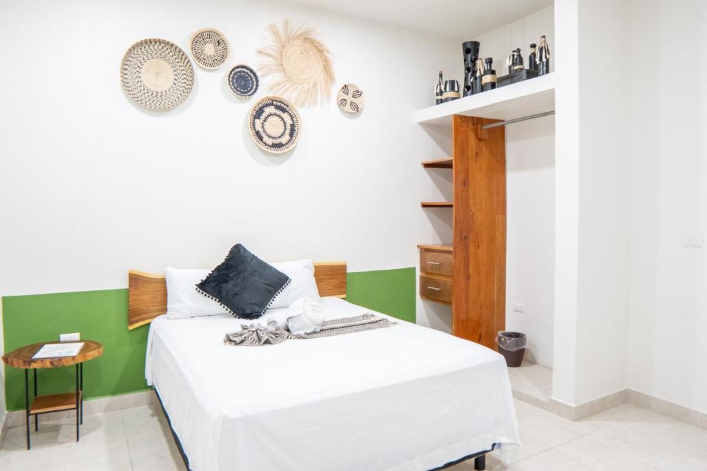 Postel nebo postele na pokoji v ubytování Hotel Makech