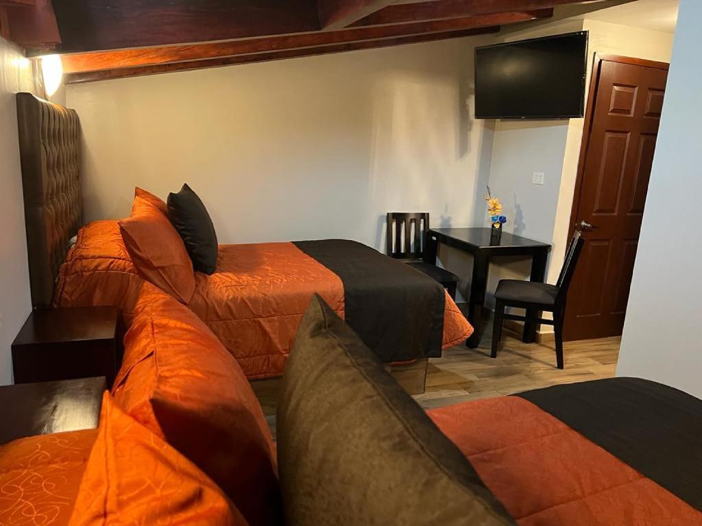TV a/nebo společenská místnost v ubytování Hotel Paraiso Real Plus