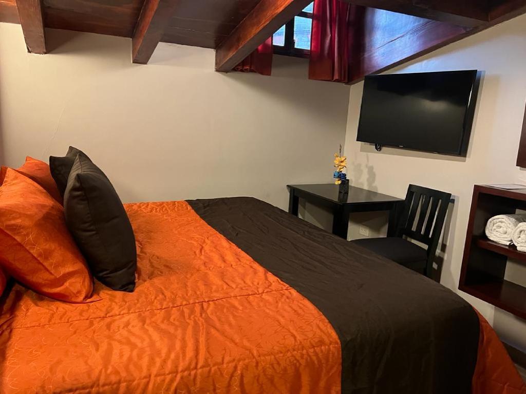 Postel nebo postele na pokoji v ubytování Hotel Paraiso Real Plus