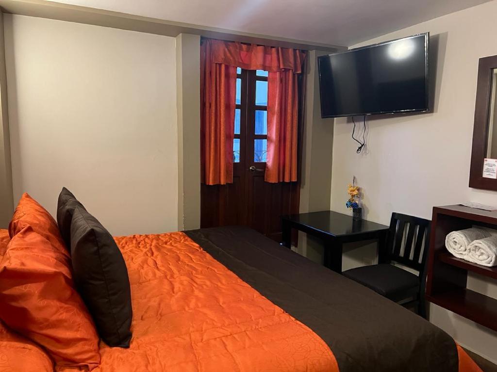 Postel nebo postele na pokoji v ubytování Hotel Paraiso Real Plus