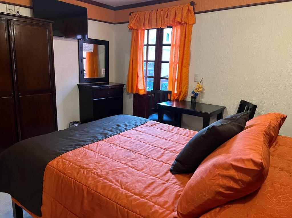 Postel nebo postele na pokoji v ubytování Hotel Paraiso Real Plus