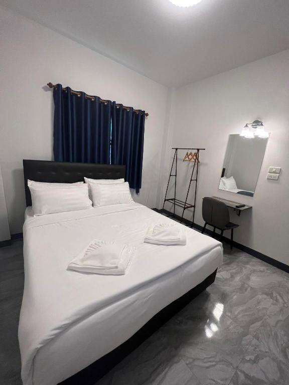 Postel nebo postele na pokoji v ubytování คีรีศิลป์ รีสอร์ท เชียงราย (Khirisin Resort Chiang rai)
