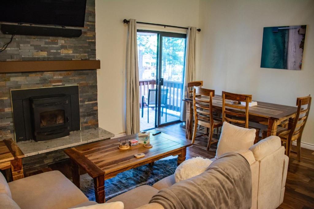 a living room with a couch and a fireplace at Family Friendly - Sleeps 6 - King Bed in Incline Village