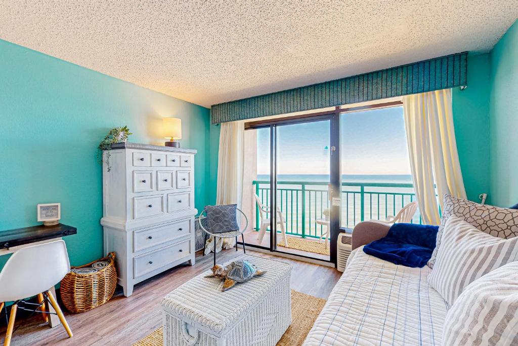 a living room with a view of the ocean at Making Memories in Myrtle Beach