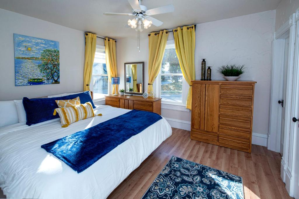 a bedroom with a large bed and a window at Vintage downtown flat near Holy Hill, Golf &Ski in Hartford