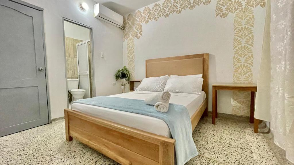 Postel nebo postele na pokoji v ubytování Hotel Balcon de Oro Curumani