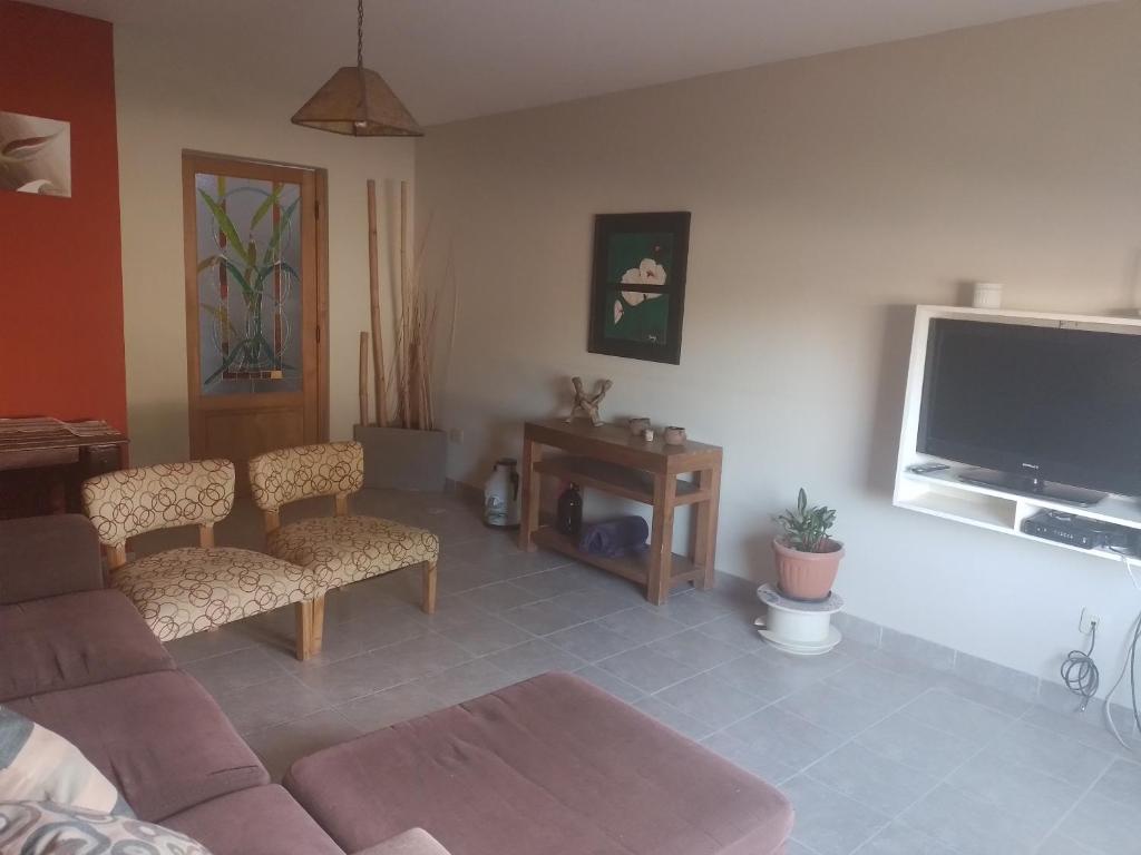 TV a/nebo společenská místnost v ubytování Las Lavandas ´´Casa de Playa´´