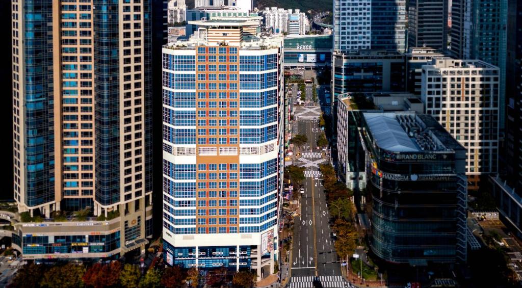 an aerial view of a city with tall buildings at Centum Business Hotel in Busan