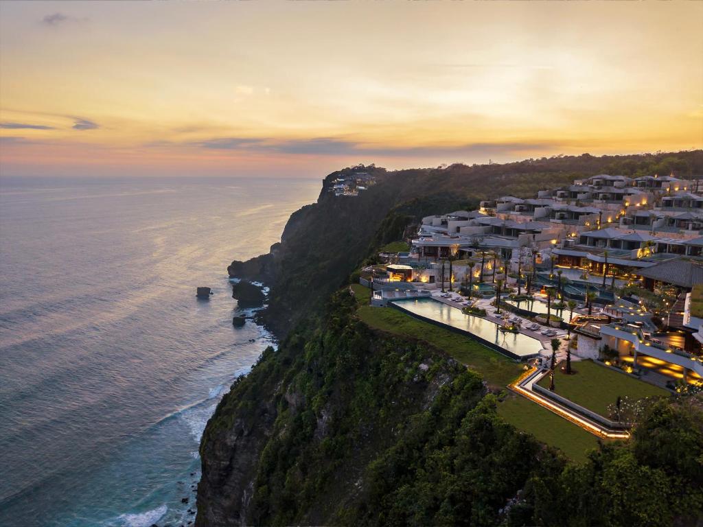 an aerial view of a resort on a cliff next to the ocean at Six Senses Uluwatu in Uluwatu