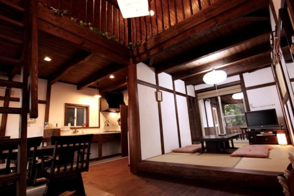 a large room with a living room and a dining room at 天然温泉！古民家風の貸切り一軒家 【白山リバーサイドコテージ 】2-120号棟 in Nihongi
