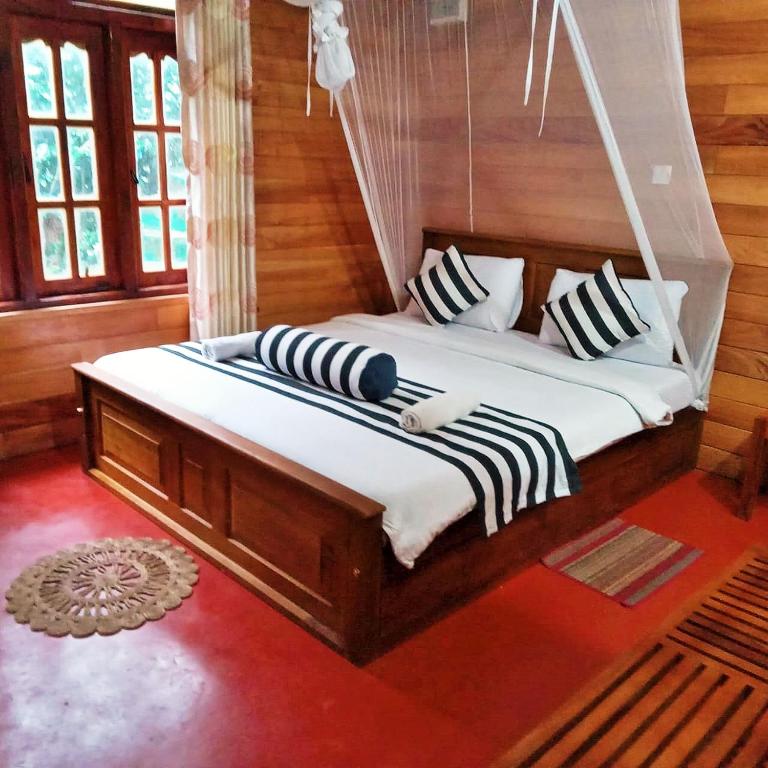 Postel nebo postele na pokoji v ubytování Green cottage Ella