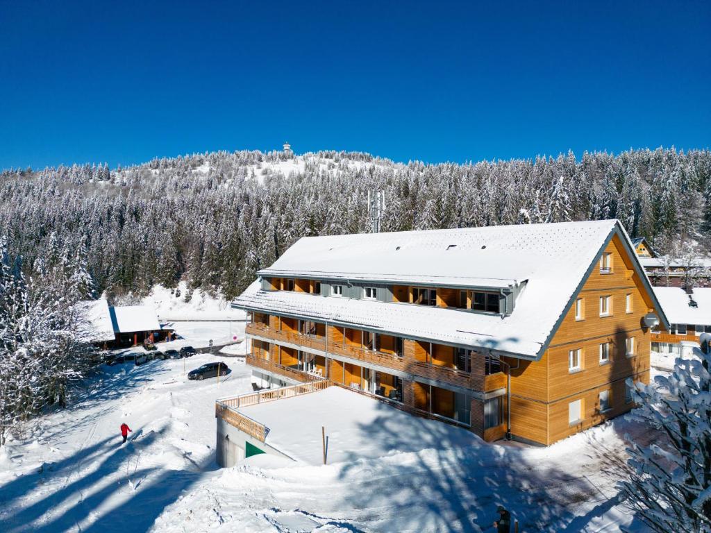 an aerial view of a building in the snow at Stube9 am Feldberg, direkt an der Skipiste, Ski in-Ski out in Feldberg