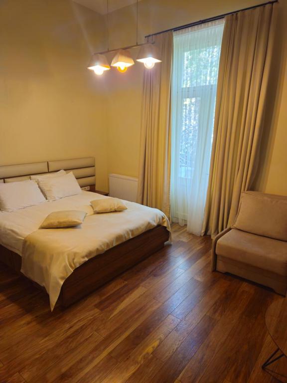 Postel nebo postele na pokoji v ubytování Boutique Hotel Filosofia