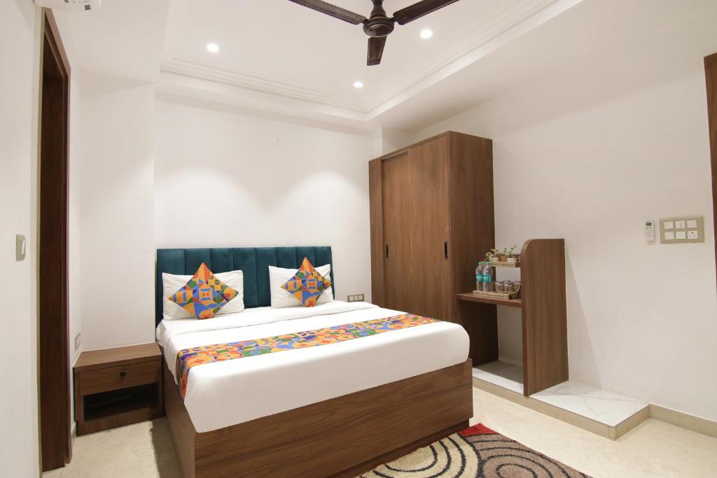 a bedroom with a large bed in a room at FabHotel La Serene BnB- Ashok Vihar in New Delhi