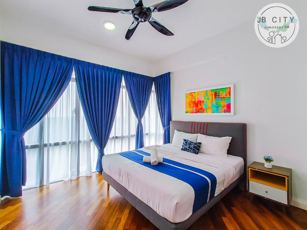 Postel nebo postele na pokoji v ubytování Grand Medini Suites by RR JBcity