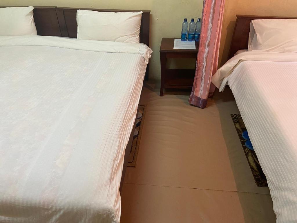 Postel nebo postele na pokoji v ubytování Ranges View Lodge Staycation
