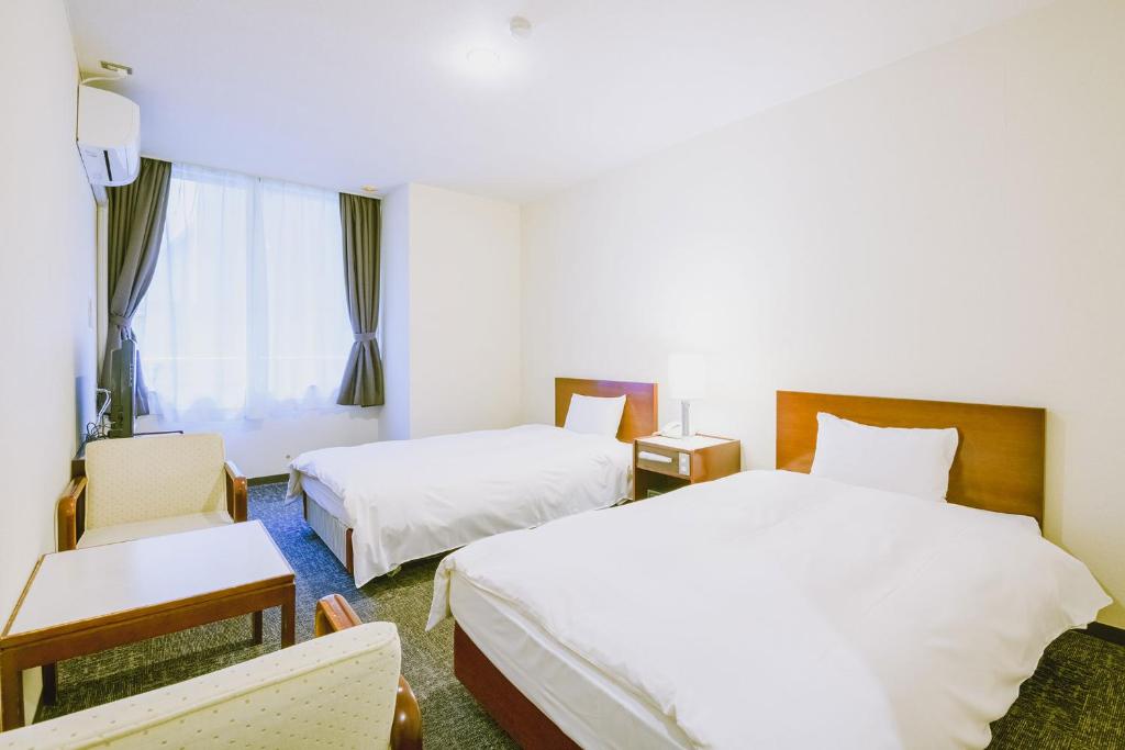 Postel nebo postele na pokoji v ubytování Ooedo Onsen Monogatari Awara